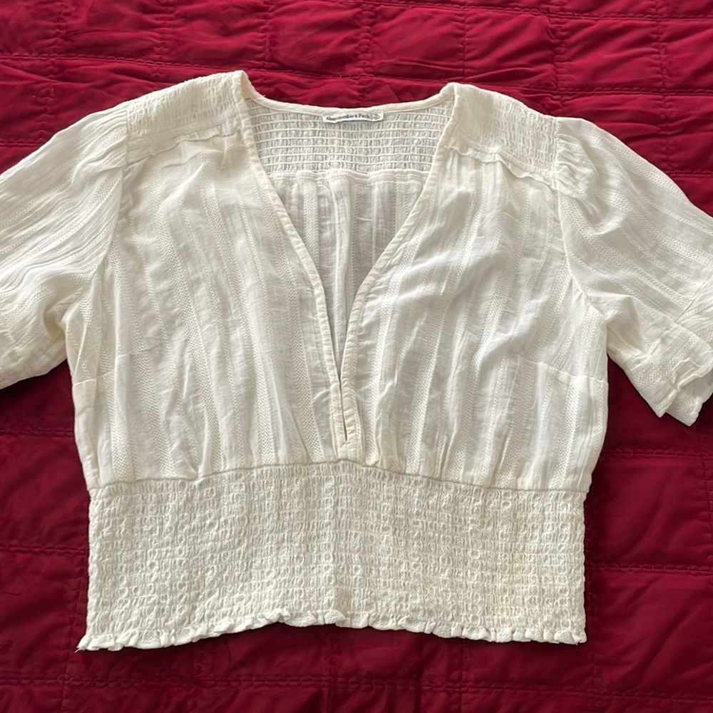 White Abercrombie & Fitch top.